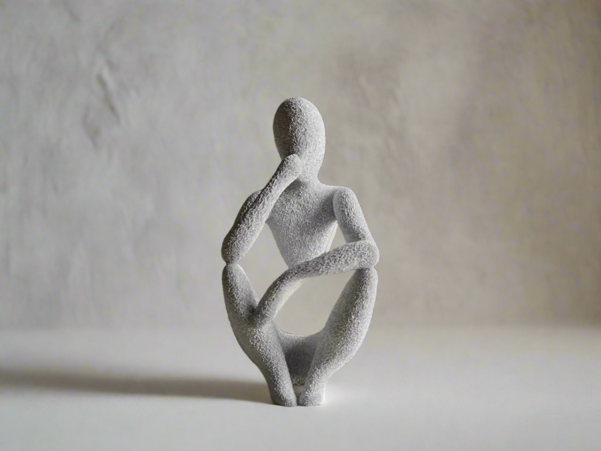 Decorative sculpture of a sitting figure