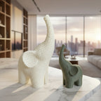 Two knitted elephant toys on a dark surface with a blurred background